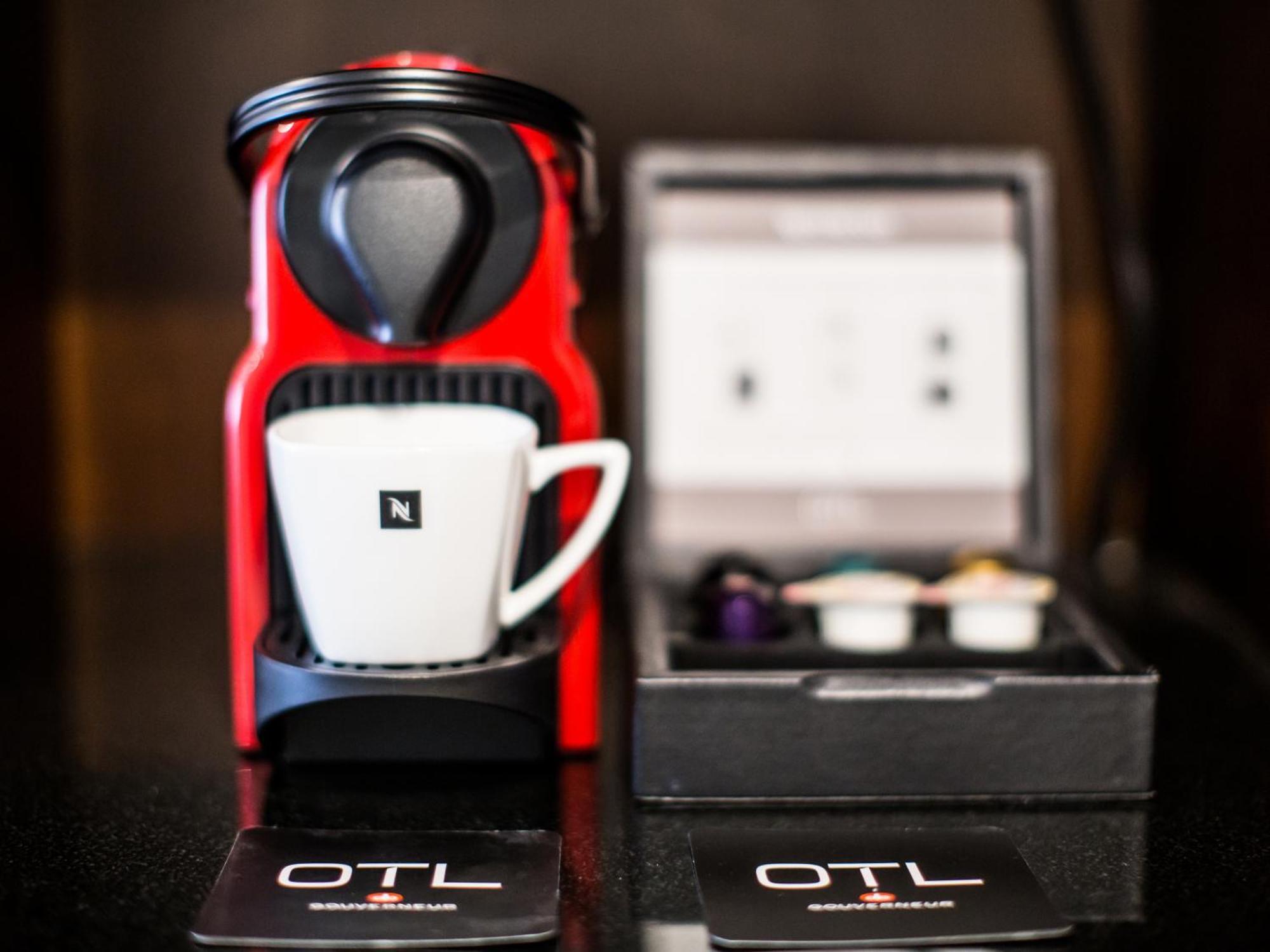 Otl Gouverneur Saguenay Exterior photo A Nespresso Inissia coffee machine